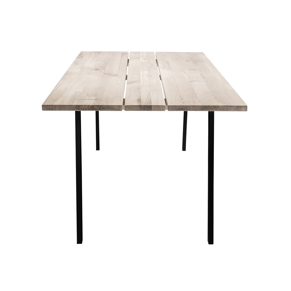 Product photograph of Bloomingville Cozy Dining Table In Natural Oak Black Legs from Olivia's.