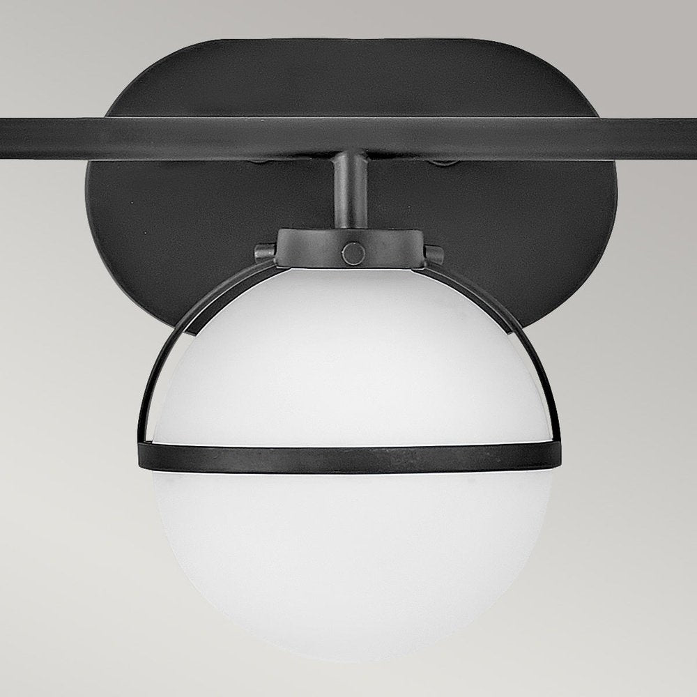 Product photograph of Hinkley Hollis 3 Light Wall Light In Black Opal Glass from Olivia's.