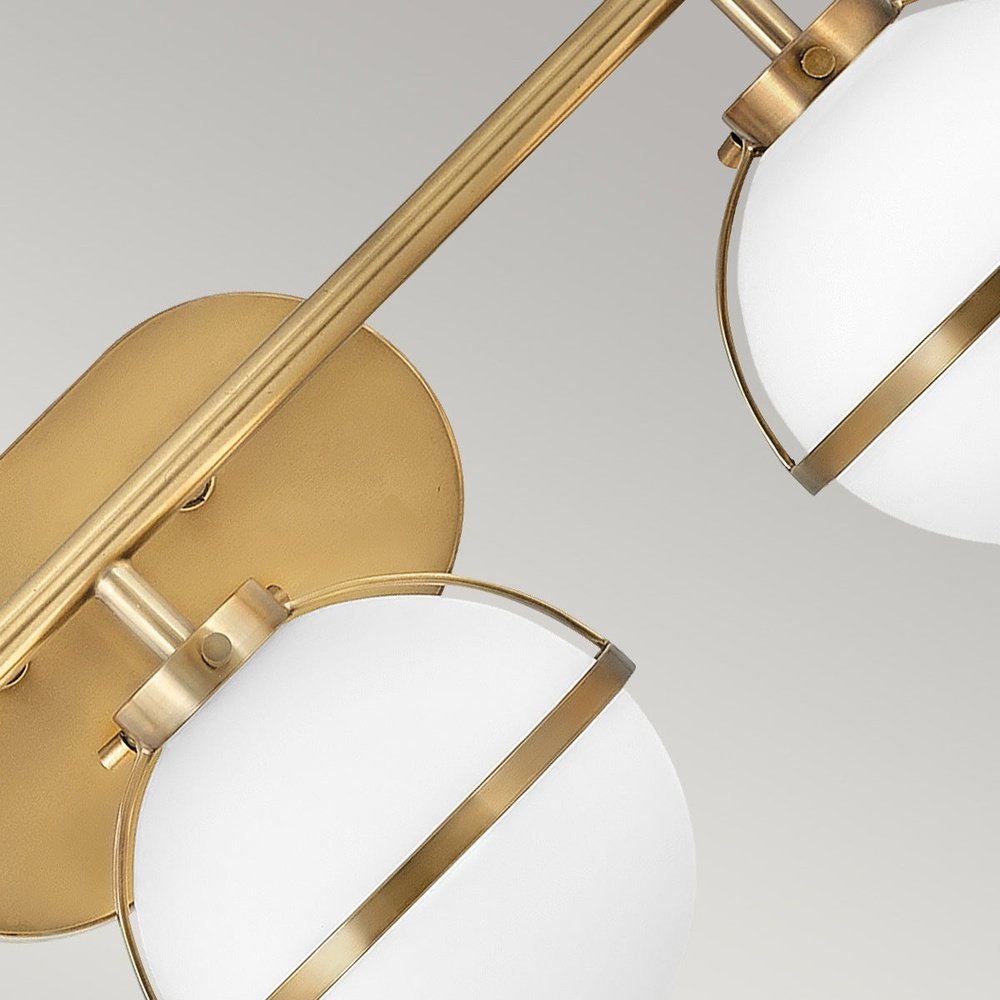 Product photograph of Hinkley Hollis 3 Light Wall Light In Brass Clear Glass from Olivia's.