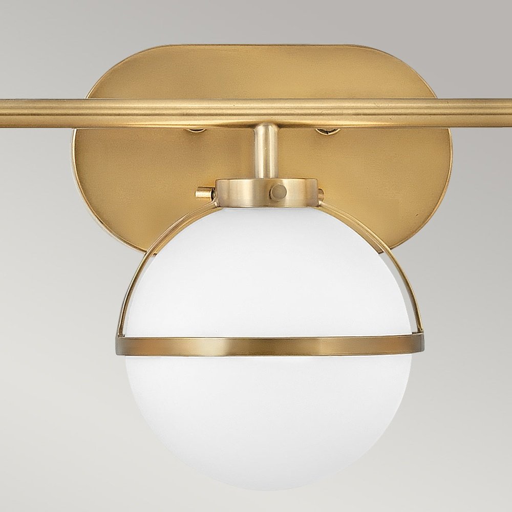 Product photograph of Hinkley Hollis 3 Light Wall Light In Brass Clear Glass from Olivia's.