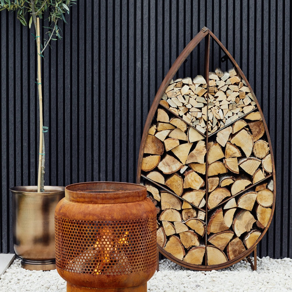 Product photograph of Ivyline Leaf On Stand Sculptural Log Storage Natural Rust from Olivia's.