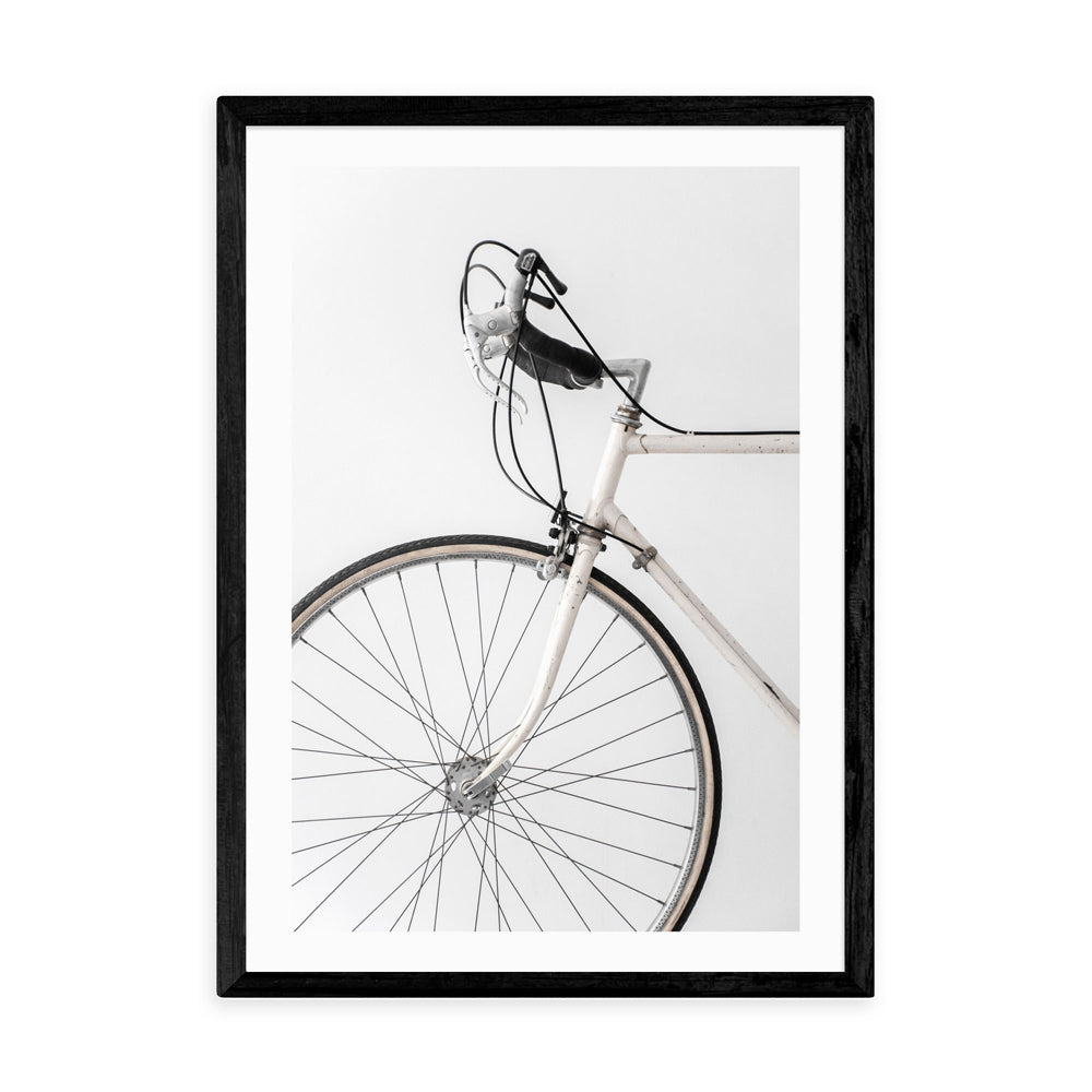 Product photograph of 338 White Minimal Bicycle By Studio Na Hili - A3 Black Framed Art Print from Olivia's
