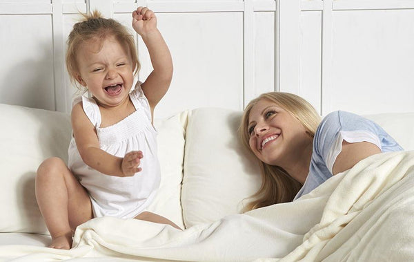 Baby and Mom snuggled up with Berkshire Blanket