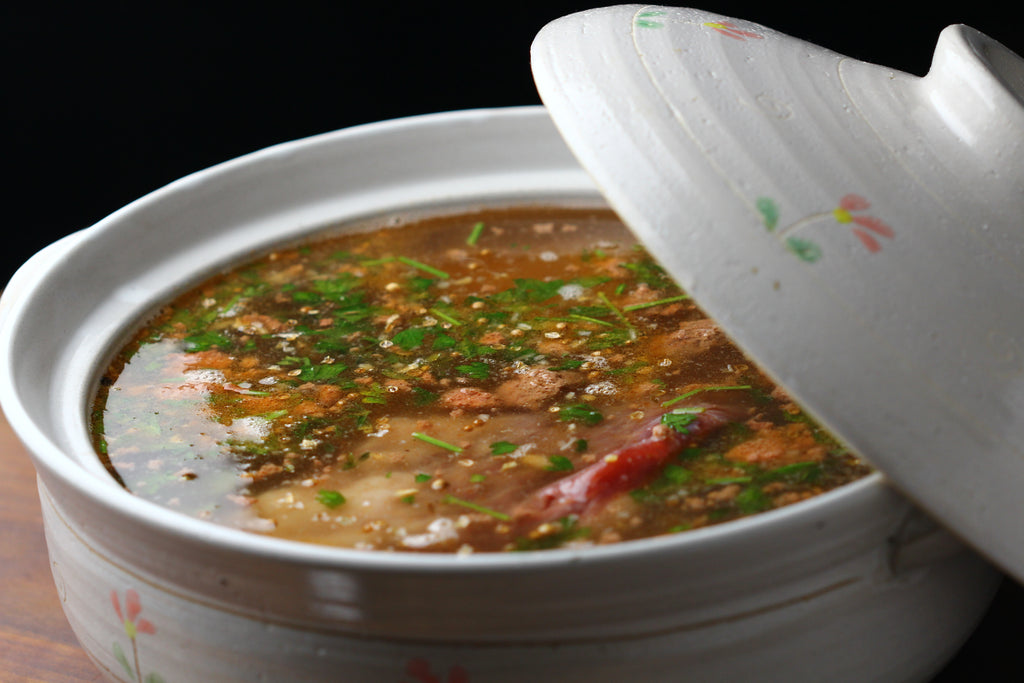 Beef Brisket with broth in a pot | whole meat