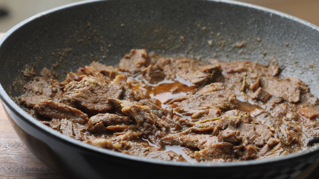 Braised brisket with chili and Mexican flavors for tacos filling