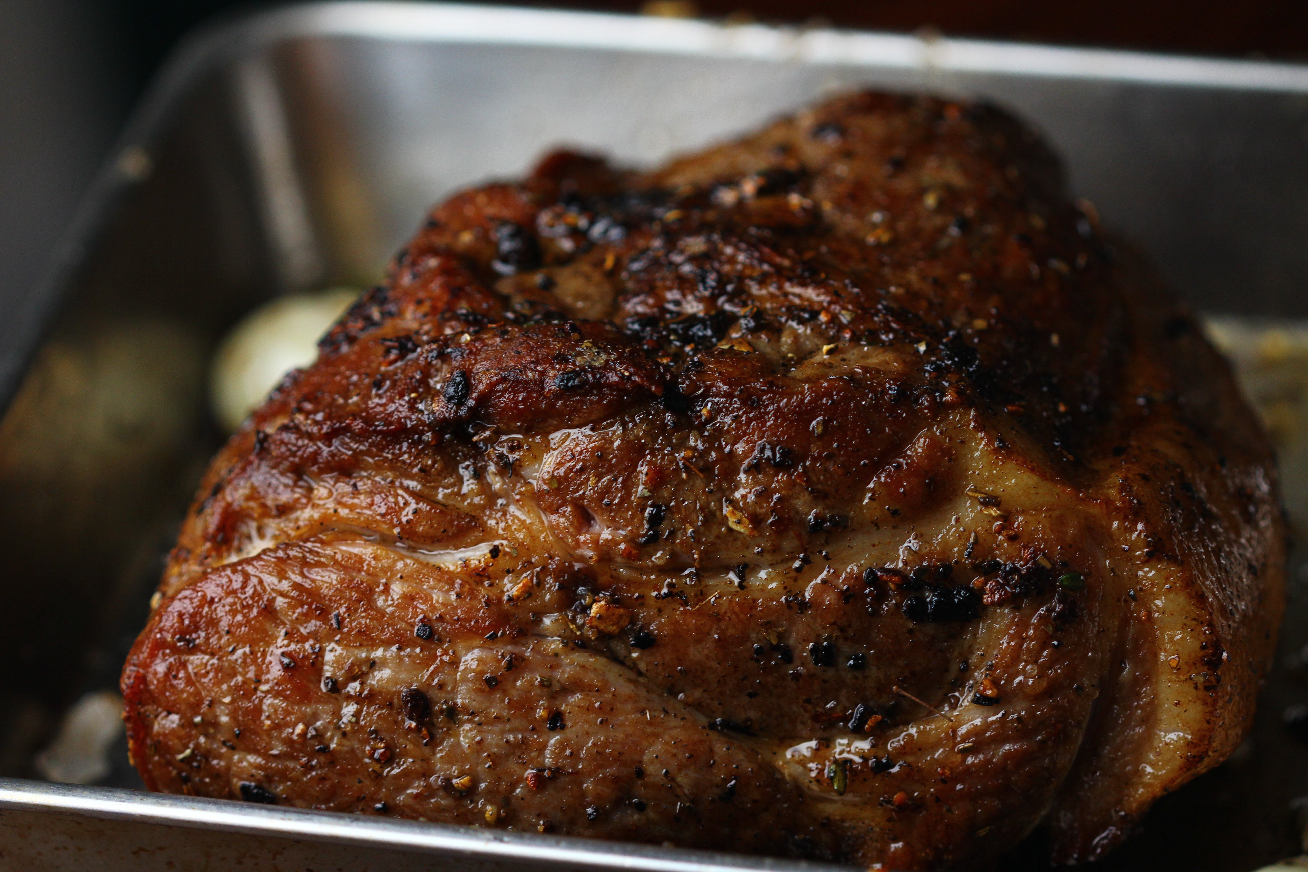 browned boneless pork shoulder ready for roasting