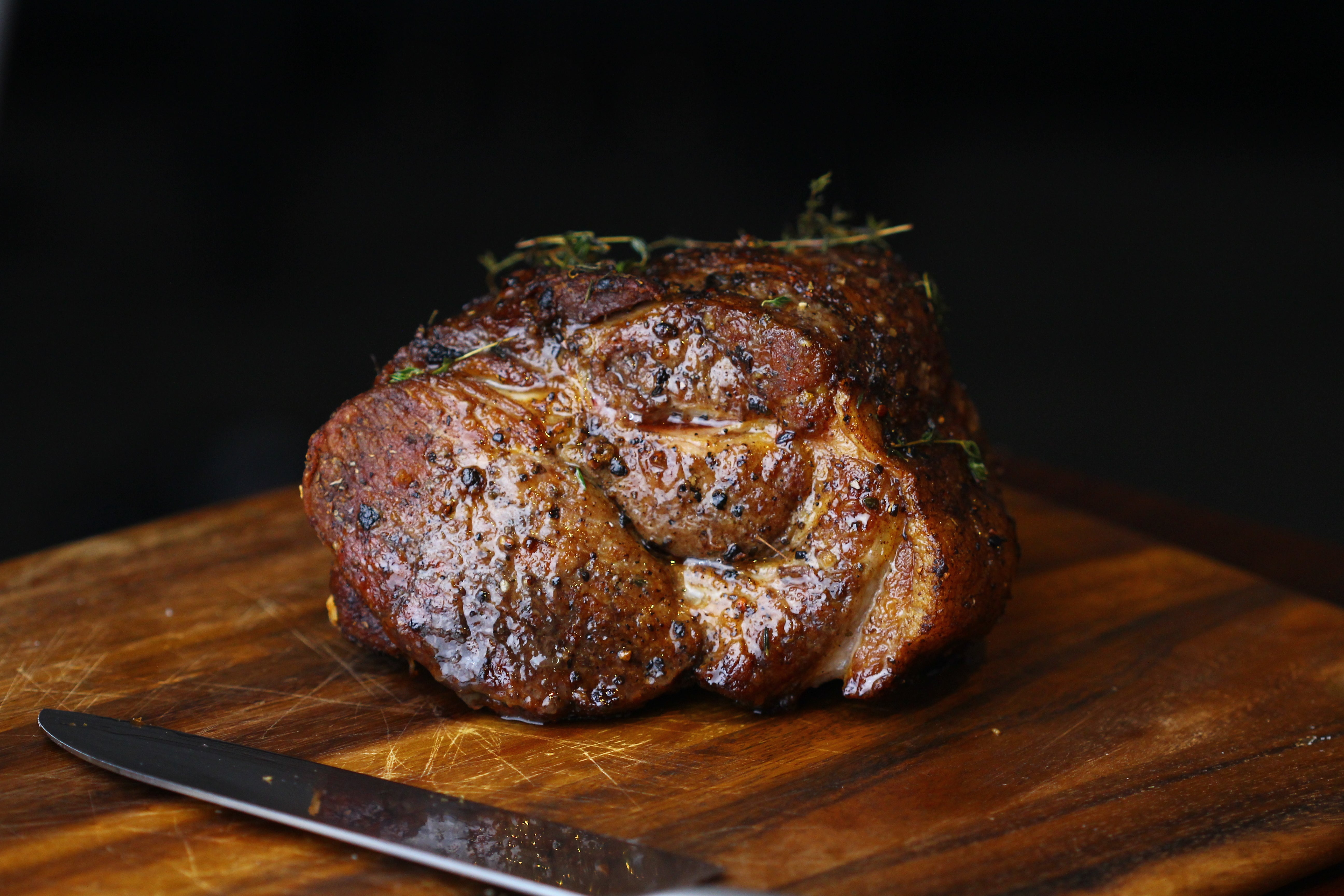 Pork shoulder roast resting before slicing 