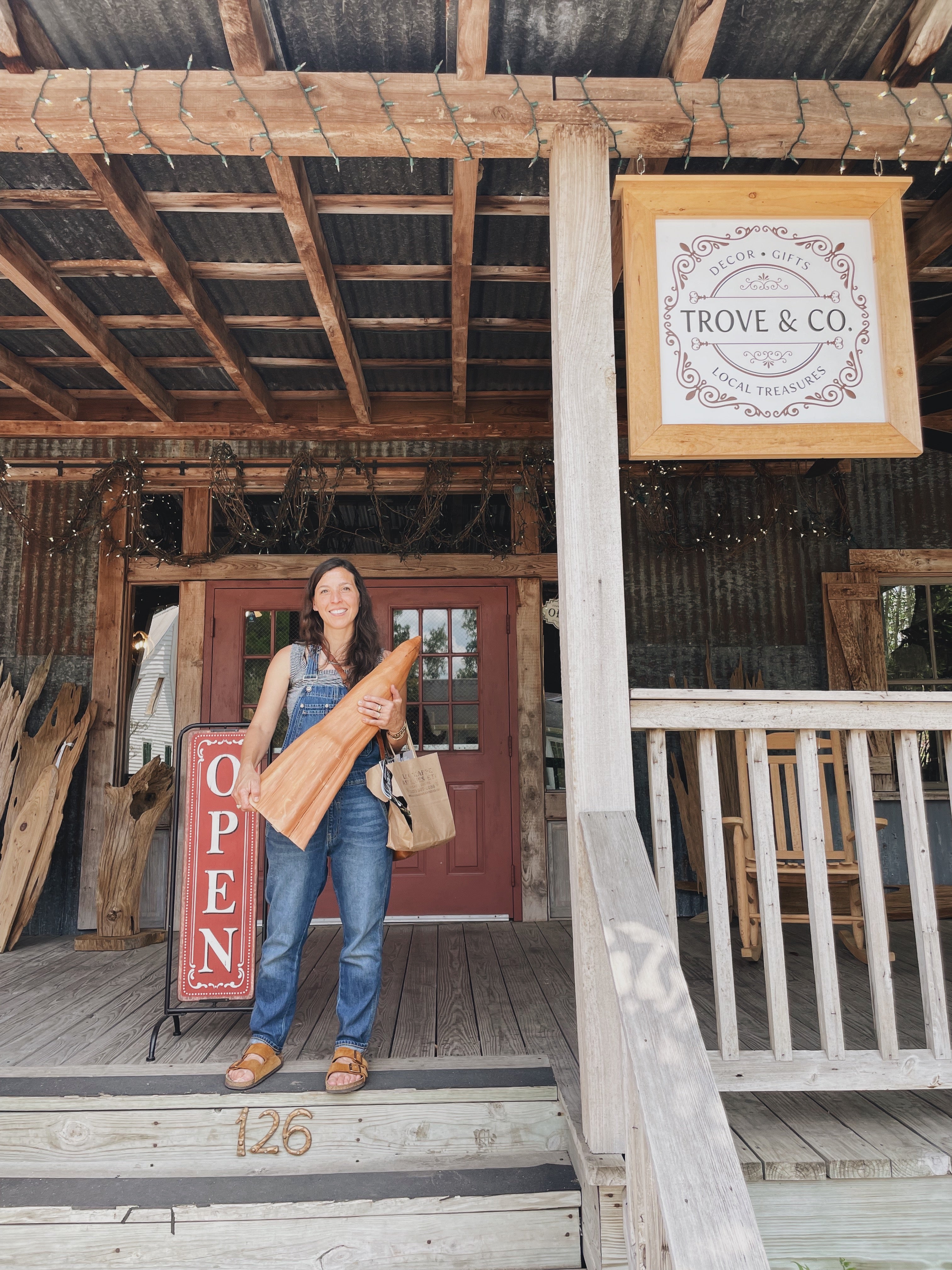 Madeline Holds a Cypress Knee Purchased From Trove & Company in Breaux Bridge, Louisiana