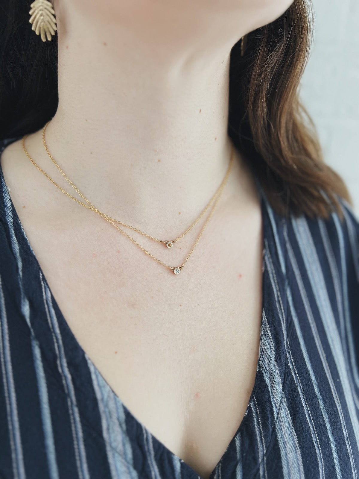 Woman Wears MIMOSA Handcrafted Grace Necklaces With Citrine And Blue Topaz Stones