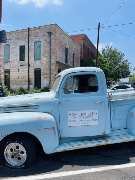 A Old Blue Truck In The Tiny Town Of Smithville, Texas