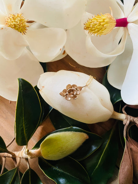 MIMOSA Handcrafted's Magnolia Necklace is Nestled Into the Petal of Magnolia Bloom