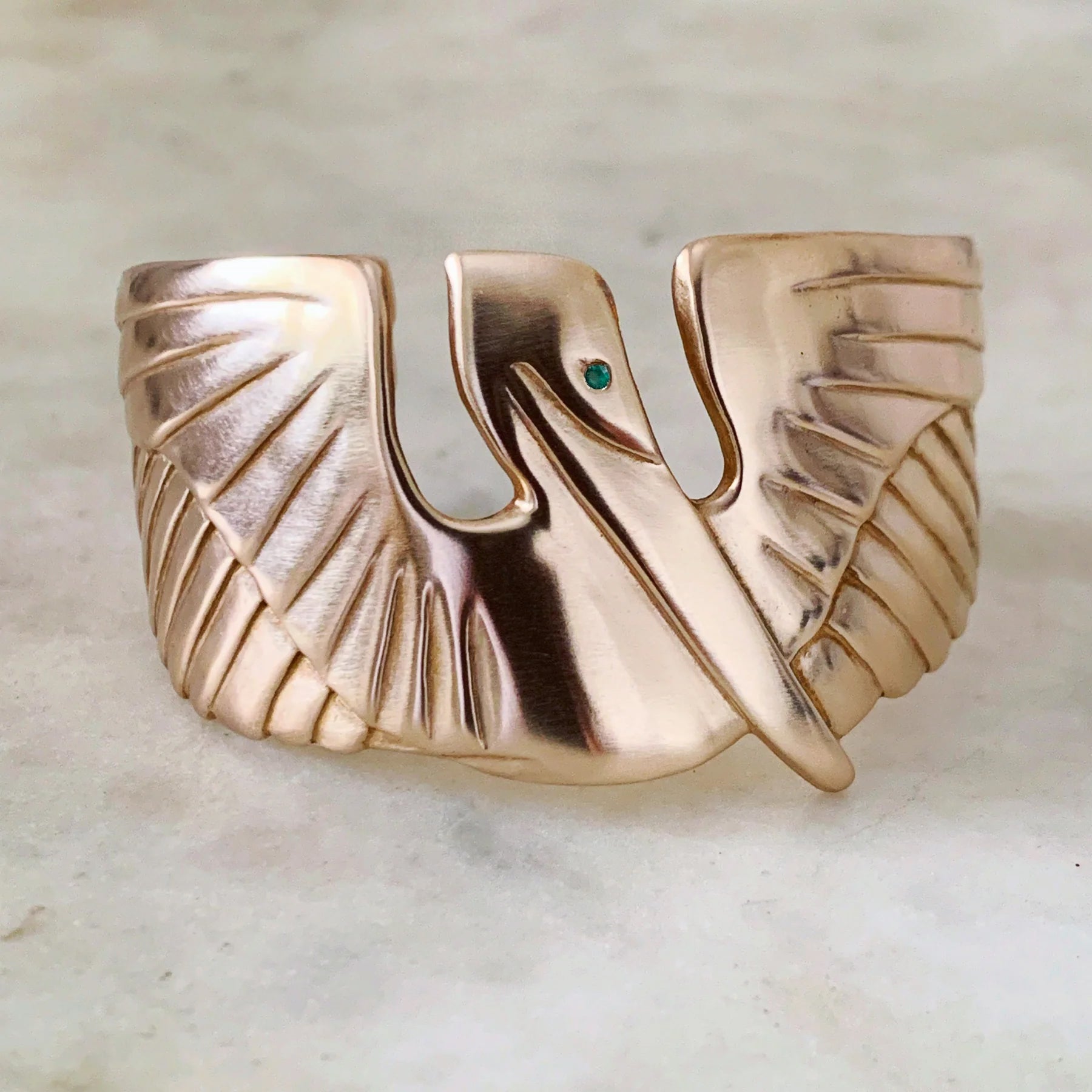 MIMOSA Handcrafted Pelican Cuff with an Emerald Eye