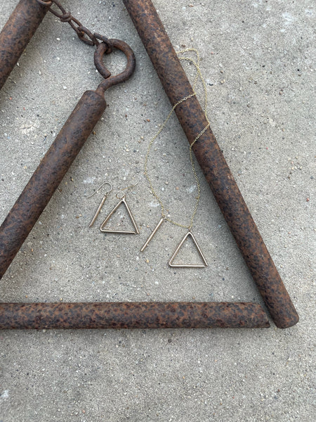 MIMOSA Handcrafted's Triangle Collection Rests Next to the Iron Triangle That Inspired It