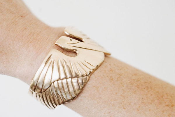 A Woman Wears MIMOSA's Bronze Pelican Bracelet