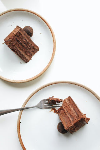 Chocolate cake on white plate