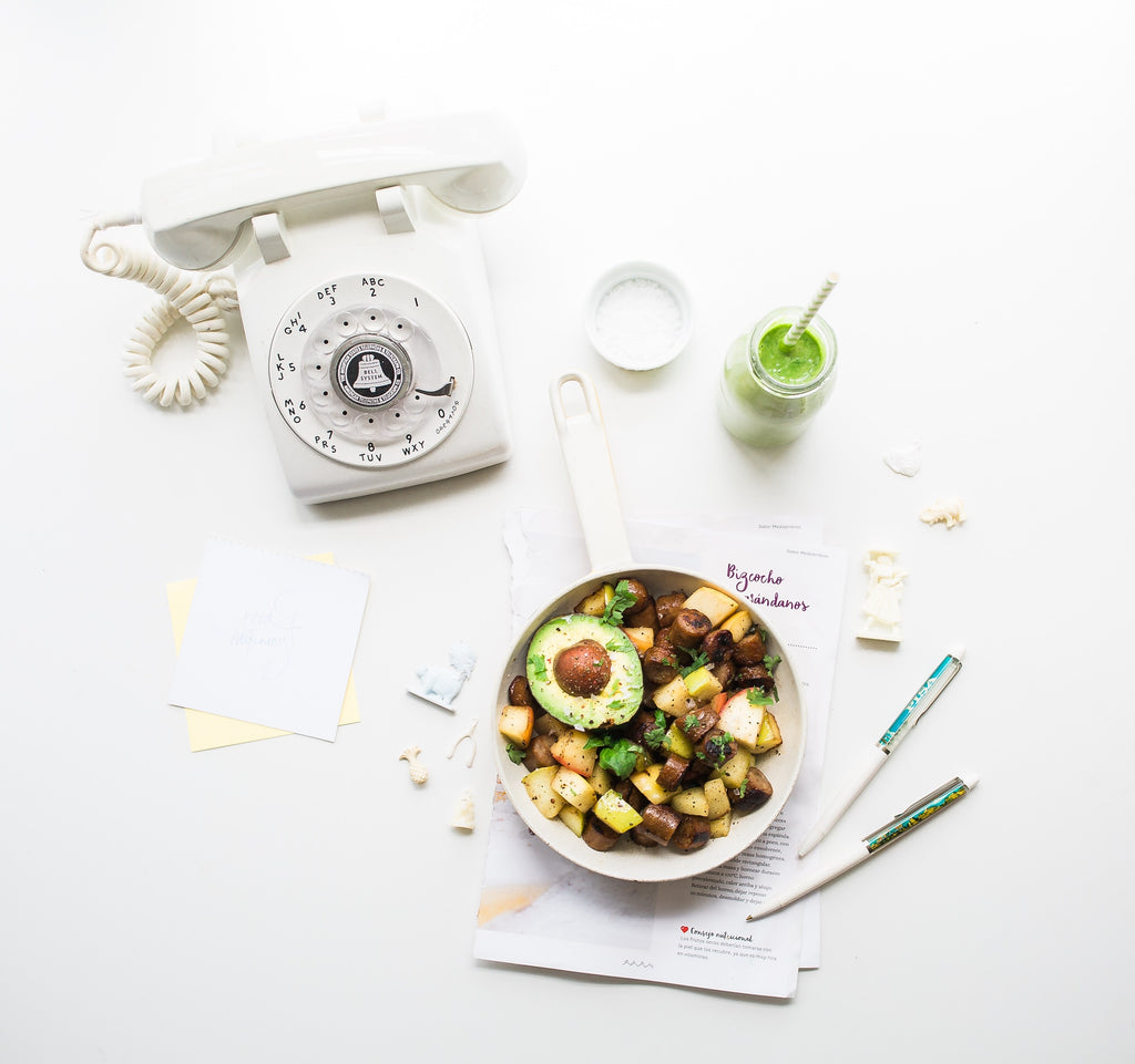 bowl of vegetables with a white phone