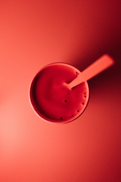 red smoothie with spoon