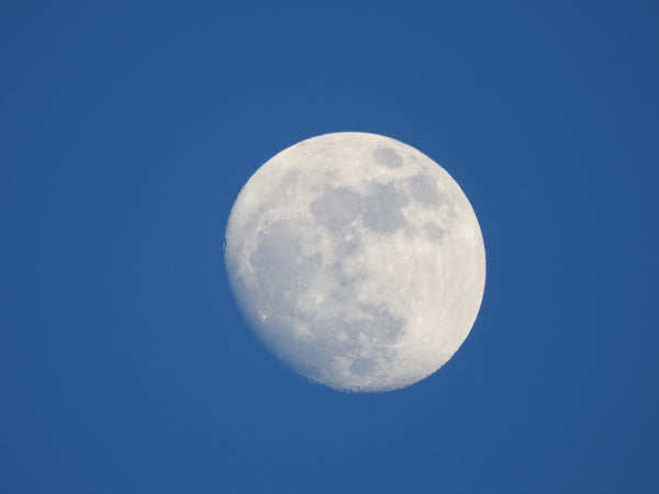 full moon on a blue sky