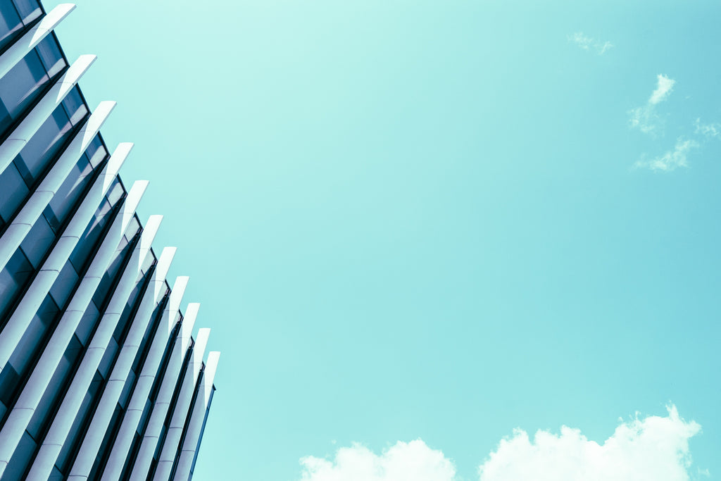 edge of building against bright blue sky