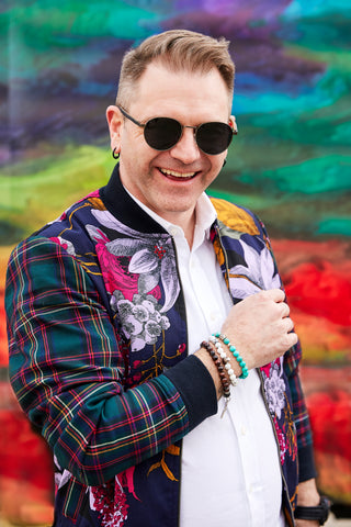 Jereme Bokitch wearing Adesso Man bracelets and sunglasses for our Spring Campaign