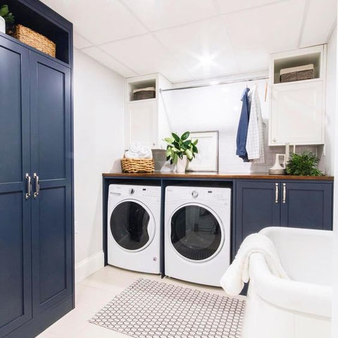 A sustainable laundry room with clothes hanging to dry 