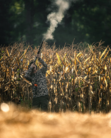 old school camo dove hunter taking a shot