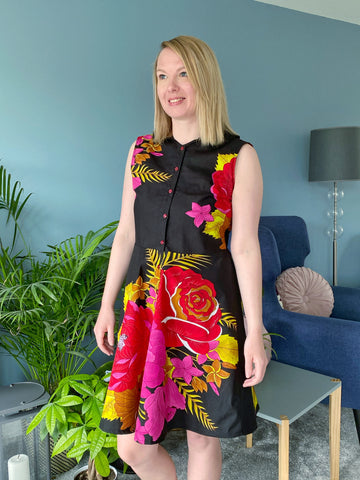 Adelle, white woman wearing her completed Etta Shirt Dress. She is facing forwards with her head turned slightly away from camera.