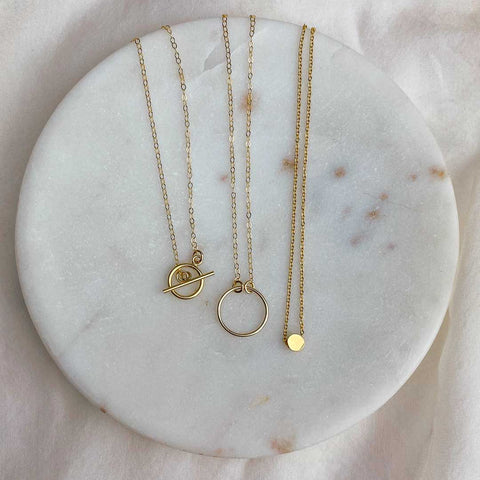 t bar ring dot necklaces gold on plate