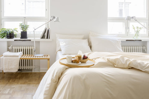 Bedroom setting with beige organic cotton covers from Knotte