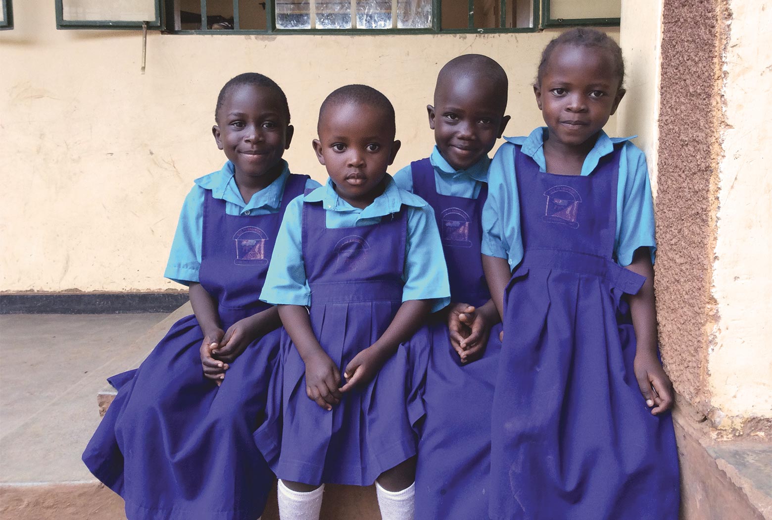 Children in class at Kamwokya Primary School in Uganda