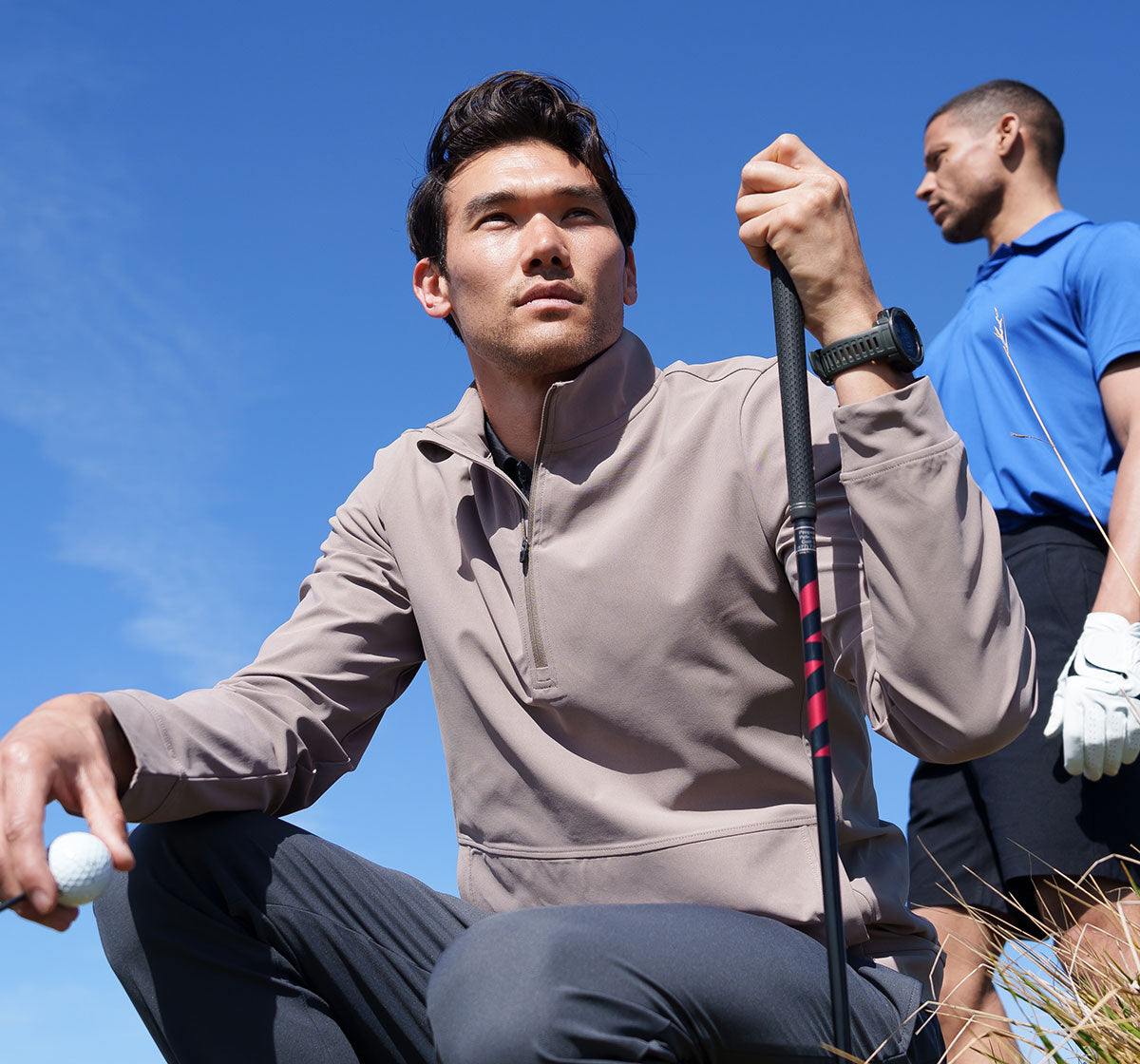 MPG male models posing on a golf course wearing MPG golf clothes