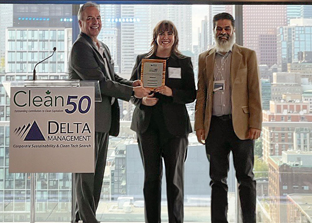 Mondetta staff Asif Khan and Erica Spiring receiving Clean50 Award in Winnipeg, Manitoba