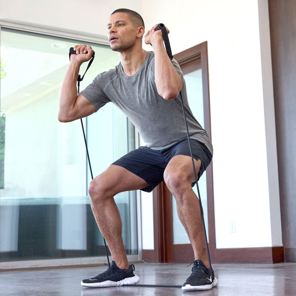 MPG male model doing an indoor resistance workout wearing MPG activewear