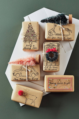 Soap wrapped in brown paper packaging decorated with festive elements. Sourced from Pinterest.