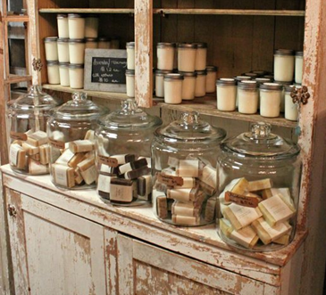 A vintage soap display with apothecary jars containing square soaps. Sourced from <span data-mce-fragment="1"><a href="https://www.pinterest.co.uk/pin/130463720447828075/" data-mce-fragment="1" data-mce-href="https://www.pinterest.co.uk/pin/130463720447828075/">Pinterest</a></span>.