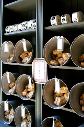 A wall-mounted soap display featuring buckets of soap bundles. Sourced from <span data-mce-fragment="1"><a href="https://www.pinterest.co.uk/pin/1266706131096320/" data-mce-fragment="1" data-mce-href="https://www.pinterest.co.uk/pin/1266706131096320/">Pinterest</a></span>.