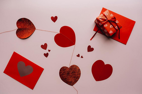 <span style="font-weight: 400;" data-mce-style="font-weight: 400;" data-mce-fragment="1">An abstract shot of Valentine’s Day packaging, including heart-themed wrapping paper, a red envelope and heart-shaped bunting. Sourced from </span><a href="https://www.pexels.com/photo/red-hearts-and-red-gift-box-6478822/" data-mce-href="https://www.pexels.com/photo/red-hearts-and-red-gift-box-6478822/" data-mce-fragment="1"><span style="font-weight: 400;" data-mce-style="font-weight: 400;" data-mce-fragment="1">Pexels</span></a><span style="font-weight: 400;" data-mce-style="font-weight: 400;" data-mce-fragment="1">.</span>