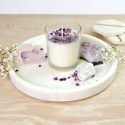 <span style="font-weight: 400;" data-mce-style="font-weight: 400;" data-mce-fragment="1">A white, unlit candle topped with purple and white crystals. Sourced from </span><a href="https://www.theworks.co.uk/p/craft-hobbies/prima-make-your-own-crystal-candle/5052089332683.html" data-mce-href="https://www.theworks.co.uk/p/craft-hobbies/prima-make-your-own-crystal-candle/5052089332683.html" data-mce-fragment="1"><span style="font-weight: 400;" data-mce-style="font-weight: 400;" data-mce-fragment="1">The Works</span></a><span style="font-weight: 400;" data-mce-style="font-weight: 400;" data-mce-fragment="1">.</span>