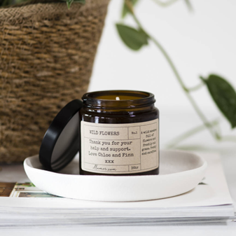 A handmade candle with a personalised note on the label from <span data-mce-fragment="1"><a href="https://www.notonthehighstreet.com/illumer/product/personalised-note-candle?sv_campaign_id=78888&amp;sv_tax1=affiliate&amp;sv_tax2=&amp;sv_tax3=Skimlinks&amp;sv_tax4=elleuk.com&amp;sv_affiliate_id=78888&amp;awc=18484_1708591109_82168183f89b26748f04f9bd9aedbde4&amp;utm_source=AWIN&amp;utm_medium=affiliate&amp;utm_campaign=Skimlinks&amp;utm_term=78888" data-mce-fragment="1" data-mce-href="https://www.notonthehighstreet.com/illumer/product/personalised-note-candle?sv_campaign_id=78888&amp;sv_tax1=affiliate&amp;sv_tax2=&amp;sv_tax3=Skimlinks&amp;sv_tax4=elleuk.com&amp;sv_affiliate_id=78888&amp;awc=18484_1708591109_82168183f89b26748f04f9bd9aedbde4&amp;utm_source=AWIN&amp;utm_medium=affiliate&amp;utm_campaign=Skimlinks&amp;utm_term=78888">Illumer</a></span>.