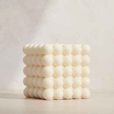 <span style="font-weight: 400;" data-mce-fragment="1" data-mce-style="font-weight: 400;">A product image of an unlit, perfectly square bubble candle. Sourced from </span><a href="https://www.insidestory.com/product/bubble-candle-63004610600.html?utm_source=rakuten&amp;utm_medium=affiliate&amp;utm_campaign=2740319%3ACafe%20La%20Moda&amp;utm_content=1&amp;ranMID=50285&amp;ranEAID=rkRbnuKbEU8&amp;ranSiteID=rkRbnuKbEU8-J02Qkv.pK7so_OBTFPQlhQ" data-mce-fragment="1" data-mce-href="https://www.insidestory.com/product/bubble-candle-63004610600.html?utm_source=rakuten&amp;utm_medium=affiliate&amp;utm_campaign=2740319%3ACafe%20La%20Moda&amp;utm_content=1&amp;ranMID=50285&amp;ranEAID=rkRbnuKbEU8&amp;ranSiteID=rkRbnuKbEU8-J02Qkv.pK7so_OBTFPQlhQ"><span style="font-weight: 400;" data-mce-fragment="1" data-mce-style="font-weight: 400;">Inside Story</span></a><span style="font-weight: 400;" data-mce-fragment="1" data-mce-style="font-weight: 400;">.</span>