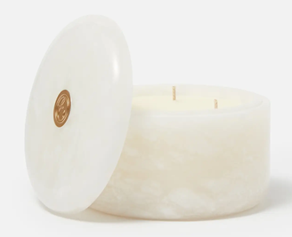 pearly white designer candle from <span data-mce-fragment="1"><a href="https://www.espaskincare.com/alabastros-bergamot-and-jasmine-candle/13884857.html" data-mce-fragment="1" data-mce-href="https://www.espaskincare.com/alabastros-bergamot-and-jasmine-candle/13884857.html">Espa</a></span>.
