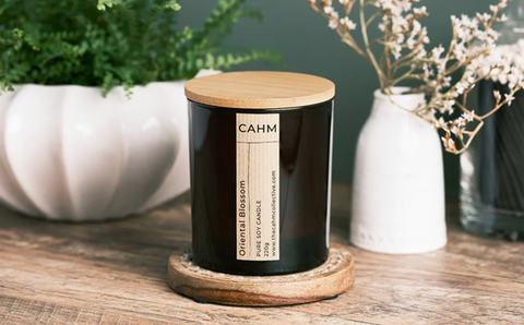 A product image of <span data-mce-fragment="1"><a href="https://thecahmcollective.com/collections/candles" data-mce-fragment="1" data-mce-href="https://thecahmcollective.com/collections/candles">The Cahm Collective</a></span>’s Oriental Blossom candle.