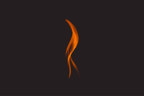 An atmospheric shot of an open flame against a black background. Sourced from Unsplash.
