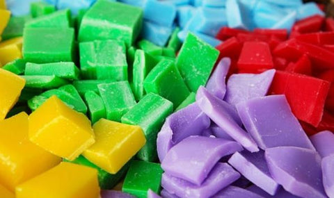 Chunks of wax in vibrant colours. Sourced from Express.