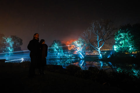 People watch the lake with laser beams