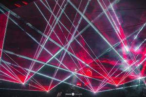 Red and White Lasers Shining throughout the room during Martin Garrix performance at Green Valley night club