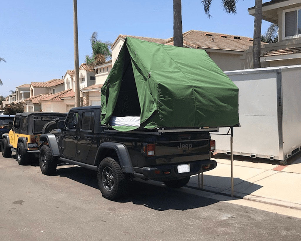 Jeep Gladiator Parked With A Custom Canvas Tent For Off Grid Camping