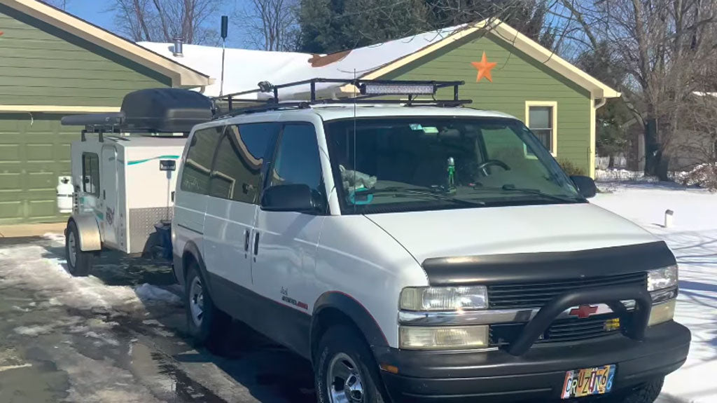 Astro Van camper conversion with travel trailer and custom roof rack