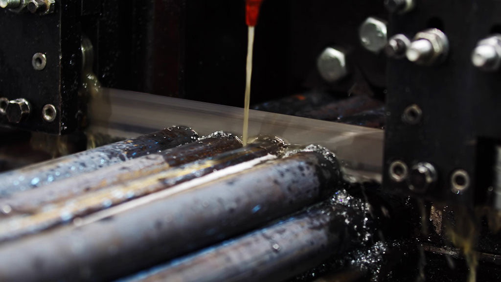 Cold saw cutting through six metal rods at once