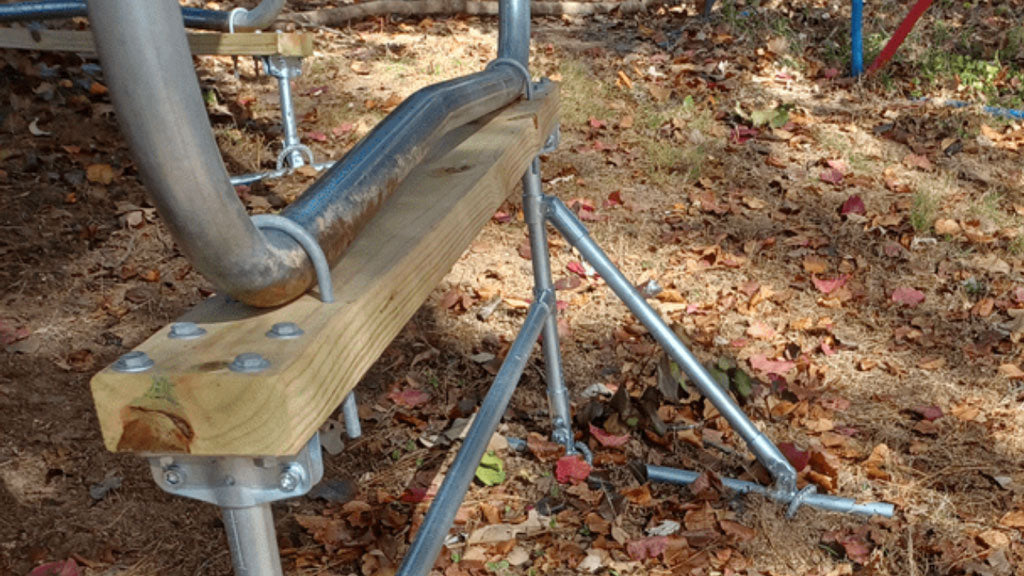 Trampoline Legs Attached To Conduit Frame With Wood And U Bolts